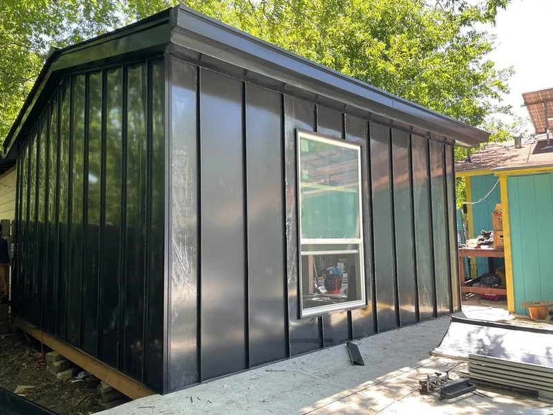 Black standing seam metal wall panels for Roof Inspection in Holiday