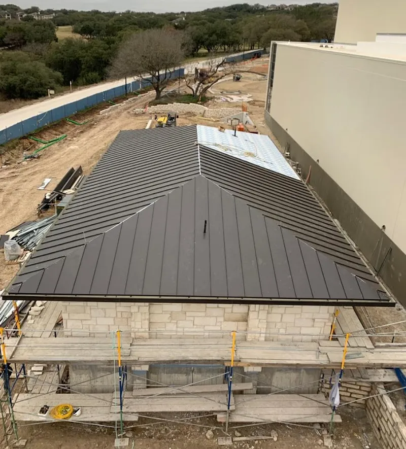Metal roof new construction with scaffolding in Holiday